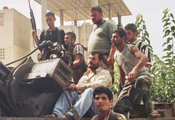 Suburban warfare: Hezbollah fighters are ready for action in a residential area.